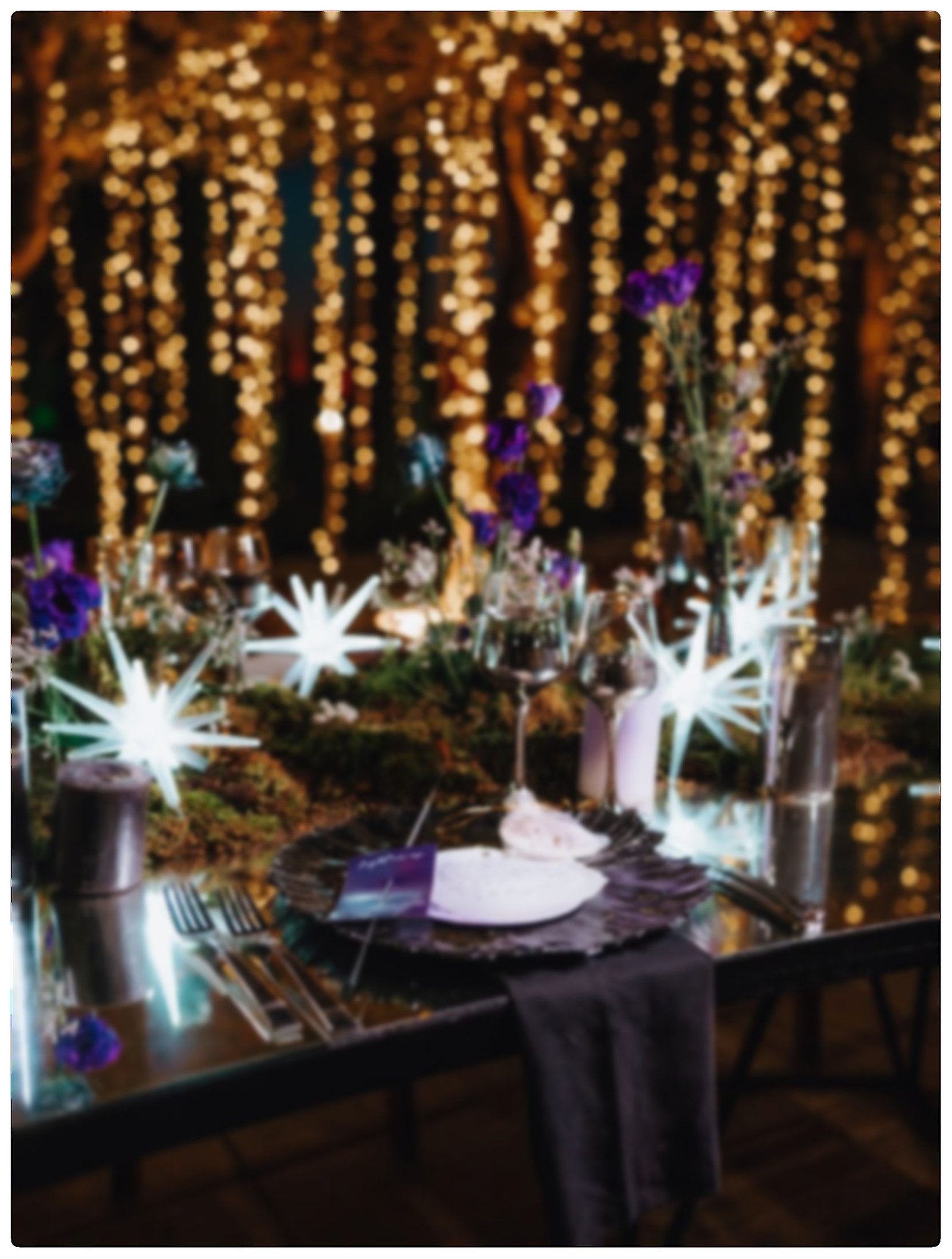 Bride in a full ball gown on an illuminated blue dance floor at night